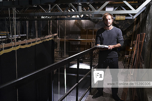 Actor with script at theatre