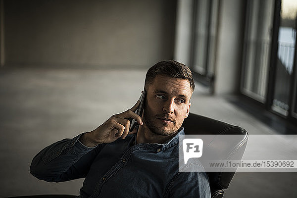 Young businessman talking on ghe phone