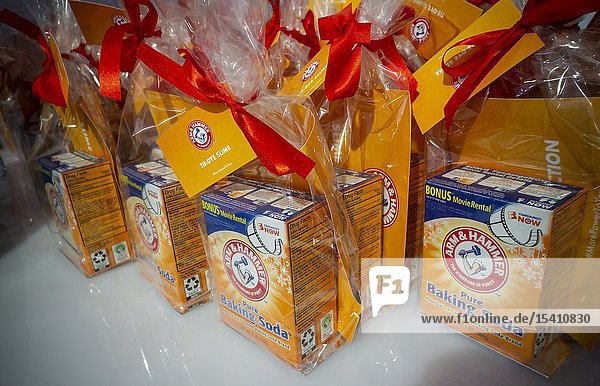 Workers distribute sample boxes of Arm & Hammer brand baking soda at a Church & Dwight branding event in New York on Saturday December 15 2018. Church & Dwight stock rose 11% in November after the household products company reported third-quarter earnings that beat Wall Street's expectations. (© Richard B. Levine).