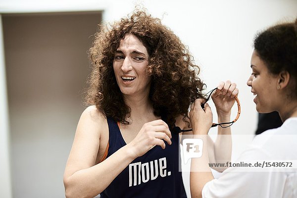 Two sporty woman in fitness studio