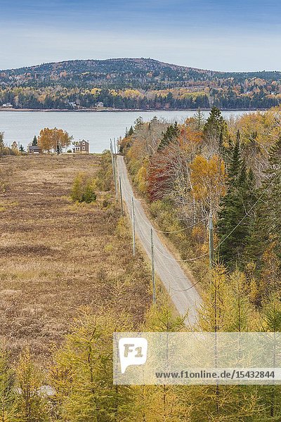 Canada New Brunswick Bay of Fundy Bayside elevated view of country road and house autumn.