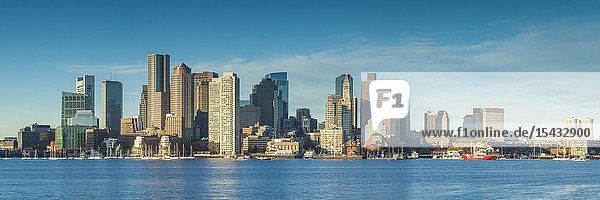 USA New England Massachusetts Boston city skyline from Boston Harbor dawn.