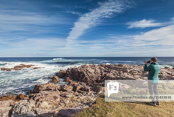 Canada Nova Scotia Cabot Trail Neils Harbour Cape Breton HIghlands National Park tourists by the shore NR.