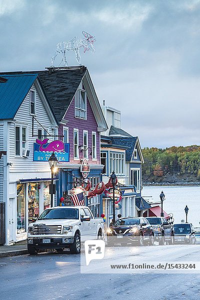 USA Maine Mt. Desert Island Bar Harbor restaurants along Main Street autumn dusk.