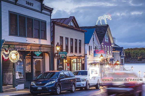 USA Maine Mt. Desert Island Bar Harbor restaurants along Main Street autumn dusk.
