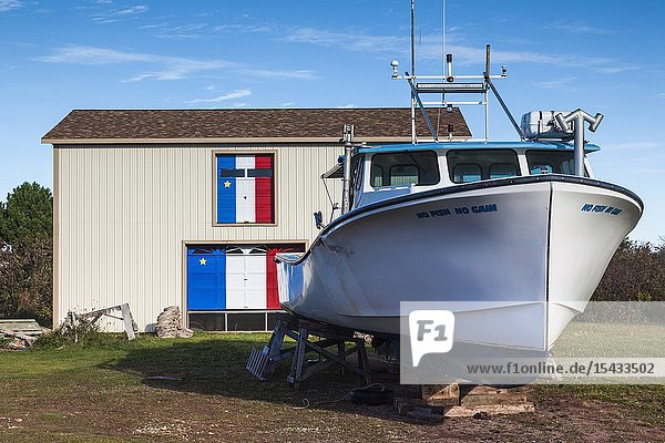 Canada Prince Edward Island Maximeville boat and Acadian painted boathouse.