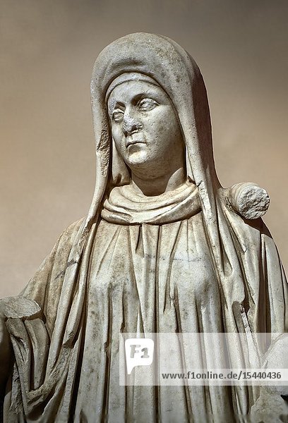 Roman statue of a priestess. Marble. Perge. 2nd century AD. Inv no 2015/192. Antalya Archaeology Museum  Turkey. Against a warm art background.