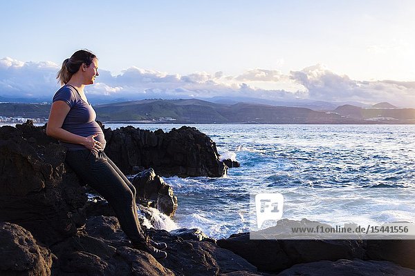 Pregnant woman enjoying the coastline of Las Palmas Canary Islands.