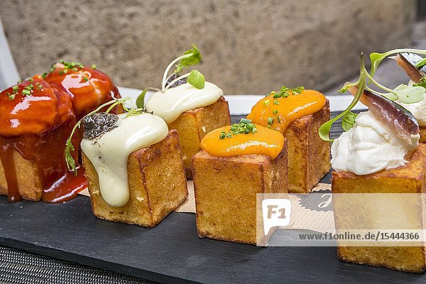 Four sauces spicy potatoes. Truffle smoked spicy and allioli. Lotelito rooms and bar. Valencia. Comunidad Valenciana. Spain.
