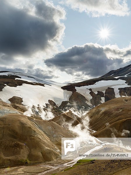 Hikers in the geothermal area Hveradalir in the mountains Kerlingarfjoell in the highlands of Iceland. Europe Northern Europe Iceland August.