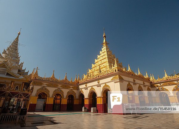 The golden pagoda and courtyard at Mahamuni Paya temple  Mandalay  Myanmar.