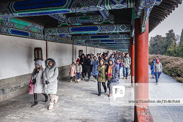 Tourists in Temple of Heaven park in Beijing China.
