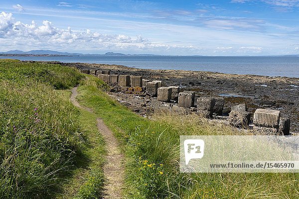 Aerial view of Second World War era anti-tank blocks on shore at Gosford Sands at Longiddry in East Lothian Scotland UK.