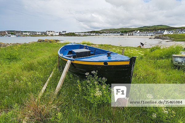 View of boat on shore at Port Ellen on Islay in Inner Hebrides Scotland UK.