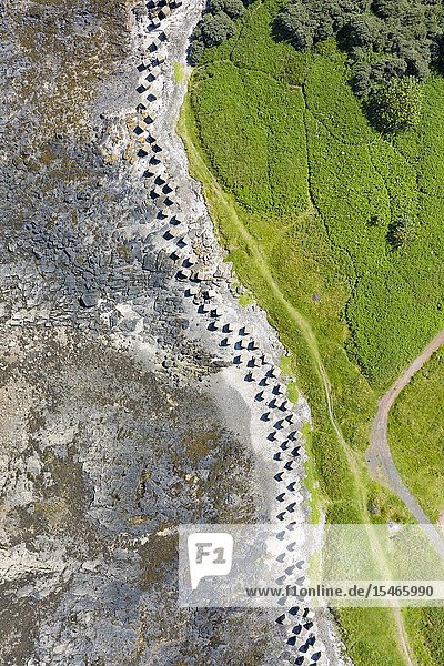 Aerial view of Second World War era anti-tank blocks on shore at Gosford Sands at Longiddry in East Lothian Scotland UK.