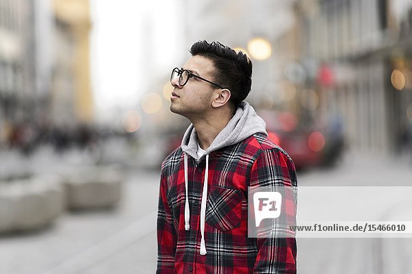 Thoughtful man in city