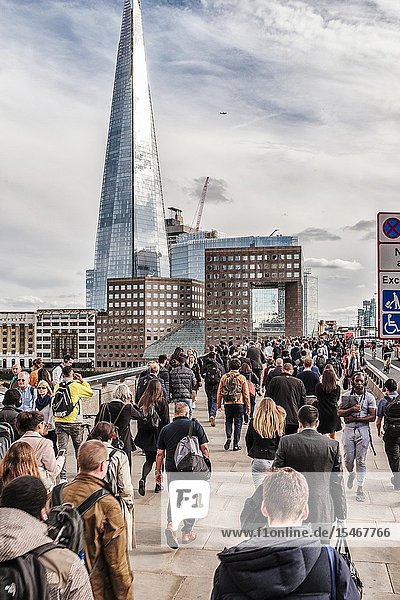 Commuters rush on London Bridge London UK.