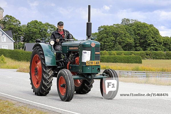 Kimito  Finland. July 6  2019. Bolinder-Munktell tractor year 1956 and driver on Kimito Traktorkavalkad  annual vintage tractor show and parade. Credit: Taina Sohlman