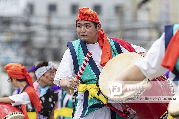 Eisa dancers perform during the Shinjuku Eisa Festival 2019 on July 27  2019  Tokyo  Japan. This year 22 Eisa dance troupes performed on the streets near to Shinjuku Station beating portable taiko drums as they moved through the crowds. The Eisa is a Bon dance originated from Okinawa which memorial service for wishing for health  safety  and prosperity of each house  and pray for the repose of the spirits.