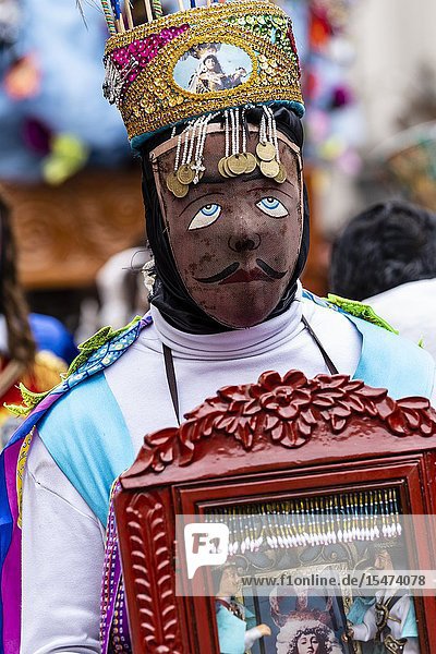 Procession of the Virgen del Carmen of Paucartambo (Cusco) characters and typical costumes. Peru South America.