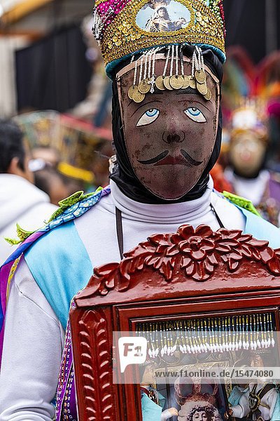 Procession of the Virgen del Carmen of Paucartambo (Cusco) characters and typical costumes. Peru South America.