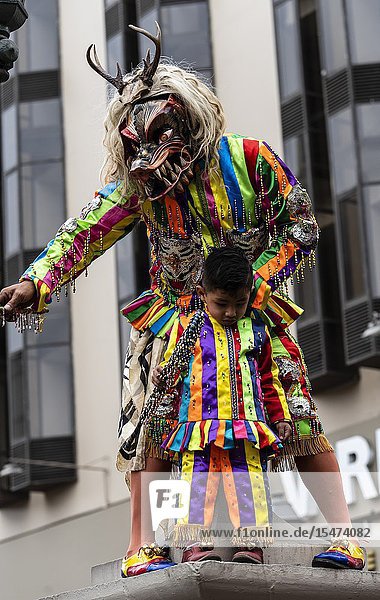 Procession of the Virgen del Carmen of Paucartambo (Cusco) characters and typical costumes. Peru South America.