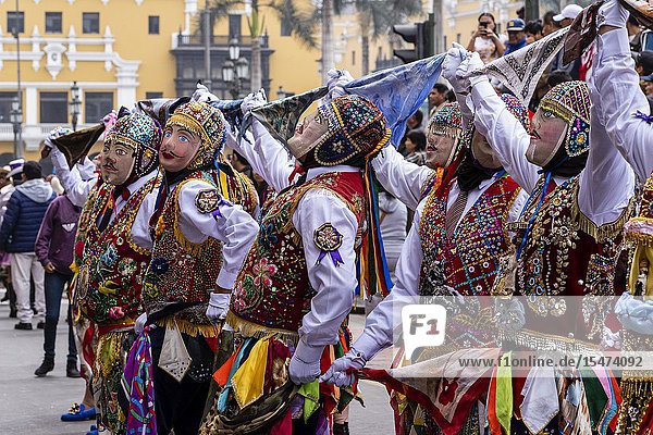 Procession of the Virgen del Carmen of Paucartambo (Cusco) characters and typical costumes. Peru South America.