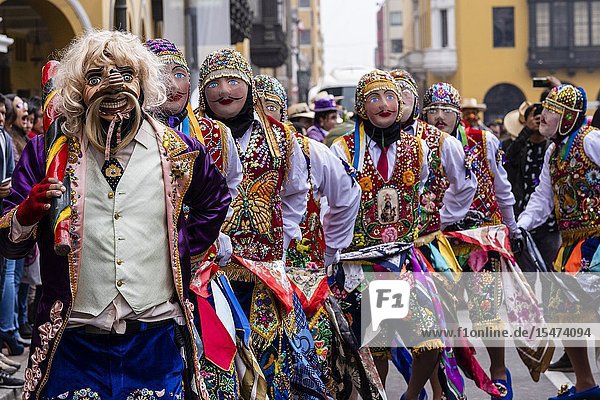 Procession of the Virgen del Carmen of Paucartambo (Cusco) characters and typical costumes. Peru South America.