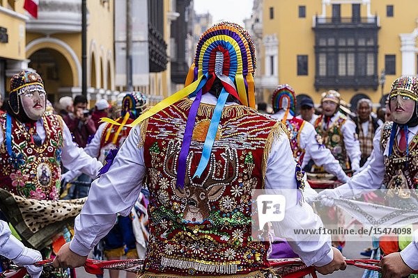 Procession of the Virgen del Carmen of Paucartambo (Cusco) characters and typical costumes. Peru South America.