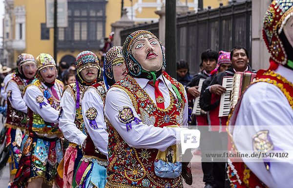 Procession of the Virgen del Carmen of Paucartambo (Cusco) characters and typical costumes. Peru South America.