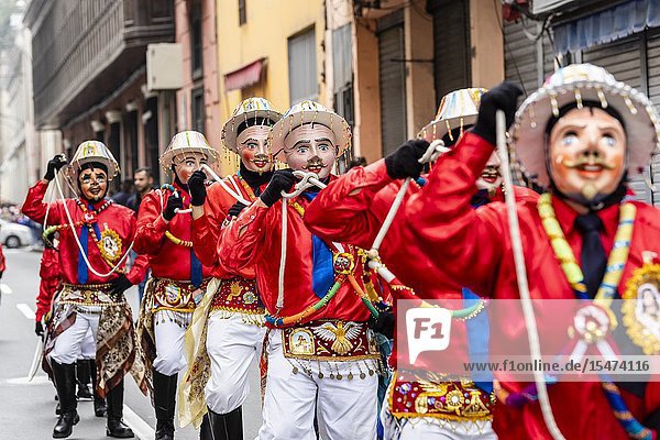 Procession of the Virgen del Carmen of Paucartambo (Cusco) characters and typical costumes. Peru South America.