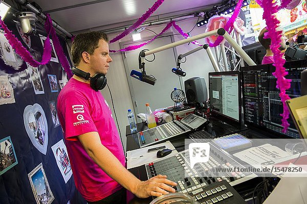 Tilburg Netherlands. DJ Edwin Noorlander of Radio 538 during his Radio Show at the annual fair's Pink Monday.