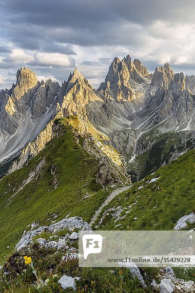 Italy Veneto Belluno district Auronzo di Cadore a man surrounded by the peaks of Cadini di Misurina.
