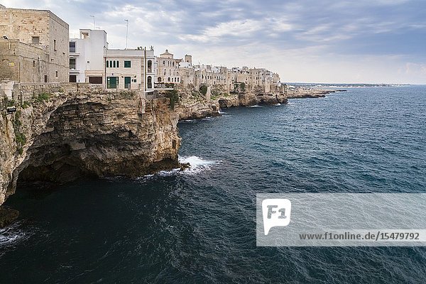 View of the overhanging houses and caves of Polignano a Mare. Bari district Apulia Italy Europe.
