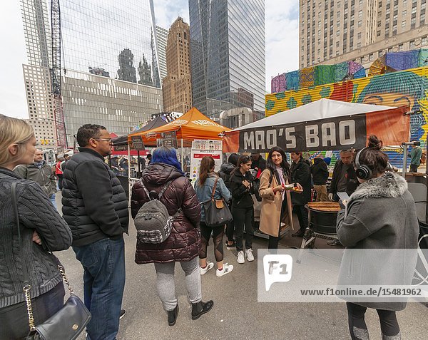 Tourists and workers in Downtown Manhattan flock to the latest iteration of the popular Smorgasburg located outside the Oculus on opening day Friday August 12 2019. The marketplace features prepared and artisanal foods by small entrepreneurs. After a one-day trial run last year the popular food court will open every Friday to feed the hungry masses in Lower Manhattan until at least October. (© Richard B. Levine).