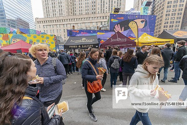 Tourists and workers in Downtown Manhattan flock to the latest iteration of the popular Smorgasburg located outside the Oculus on opening day Friday August 12 2019. The marketplace features prepared and artisanal foods by small entrepreneurs. After a one-day trial run last year the popular food court will open every Friday to feed the hungry masses in Lower Manhattan until at least October. (© Richard B. Levine).