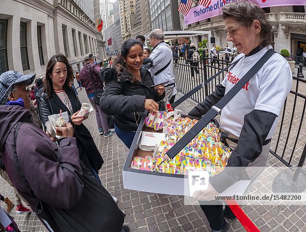 Rainbow bagels and other treats are distributed outside the New York Stock Exchange in celebration of the first day of trading for Pinterest's initial public offering (IPO) in Lower Manhattan in New York on Thursday April 18 2019. The social media giant priced its shares at $19 making the company worth over $10 billion well into the 'unicorn' range. (© Richard B. Levine).