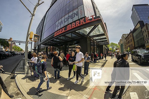 Hundreds of foodies crowd and queue up the newly opened Essex Market in the Lower East Side in New York on its opening weekend Saturday May 18 2019. The new market replaces the older Essex Street Market that dates back to Mayor LaGuardia who created the markets to remove pushcart vendors off the streets. The merchants from the now closed market have moved over and are joined by numerous food hall veterans and newbies. (© Richard B. Levine).