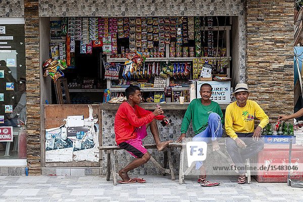 Three Filipinos Sitting Outside A Shop Boracay Aklan Province The Philippines.