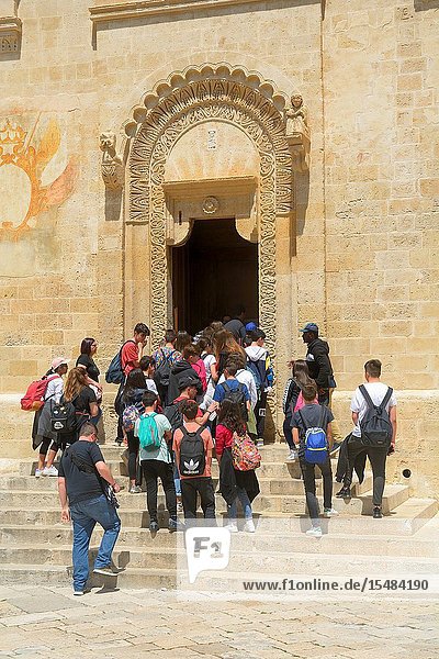 Group of people going into Matera Cathedral Matera Basilicata Italy.