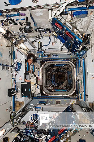 NASA astronaut Sunita Williams  Expedition 33 commander  uses a vacuum cleaner during housekeeping operations in the Harmony node of the International Space Station.