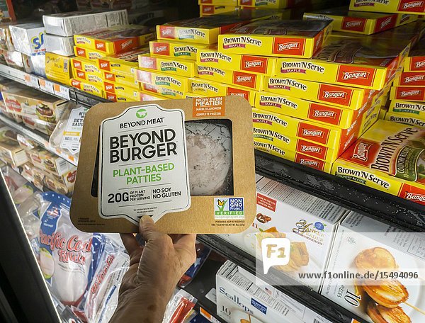 A discerning shopper chooses a package of Beyond Meat from a freezer in a supermarket in New York on Tuesday July 16 2019. Blue Apron announced that it will add Beyond Meat menus to its repetoire. (© Richard B. Levine).