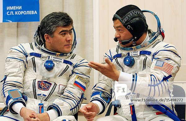 Astronaut Leroy Chiao (right)  Expedition 10 commander and NASA International Space Station (ISS) science officer  cosmonaut Salizhan S. Sharipov (left)  Russia's Federal Space Agency Expedition 10 flight engineer and Soyuz commander  and Russian Space Forces cosmonaut Yuri Shargin (not pictured) donned their launch and entry suits and climbed aboard the Soyuz TMA-5 spacecraft October 5  2004  at the Baikonur Cosmodrome in Kazakhstan for a dress rehearsal of launch day activities leading to their liftoff October 14 to the ISS. Chiao and Sharipov  the first crew of all-Asian extraction  will spend six months on the Station  while Shargin will return to Earth October 23 (U.S.A. time) with cosmonaut Gennady I. Padalka  Expedition 9 commander  and astronaut Edward M. (Mike) Fincke  NASA ISS science officer and flight engineer  who have been in space since April. Photo Credit: NASABill Ingalls