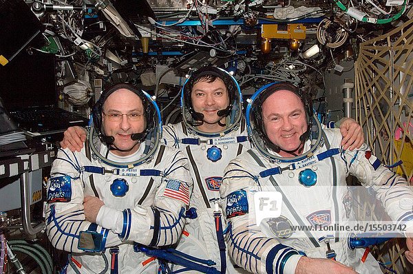 Russian cosmonaut Oleg Kononenko (center) Expedition 31 commander along with NASA astronaut Don Pettit (left) and European Space Agency astronaut Andre Kuipers both flight engineers attired in Russian Sokol launch and entry suits pose for a photo in the Destiny laboratory of the International Space Station.