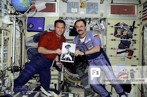 Celebrating the recent 40th anniversary of the first human-tended space flight Rosaviakosmos cosmonauts Yuri V. Lonchakov and Yury V. Usachev hold a photo of the late cosmonaut Yuri Gagarin. The STS-100 mission specialist and the Expedition Two commander are in the Zvezda Service Module on the International Space Station (ISS). Usachev and two Americans are currently hosting Lonchakov and six astronauts as work continues on the orbiting outpost. The photo was taken with a digital still camera.