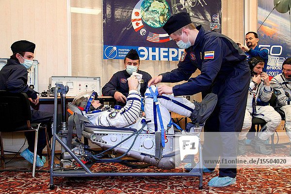 At the Baikonur Cosmodrome in Kazakhstan NASA astronaut Ron Garan Expedition 27 flight engineer conducts a leak check of his Russian Sokol launch and entry suit during a dress rehearsal of launch activities March 22 2011. Garan along with Russian cosmonauts Alexander Samokutyaev Soyuz commander and Andrey Borisenko flight engineer are scheduled to launch April 5 (April 4 U.S. time) in the Soyuz TMA-21 spacecraft that has been dubbed Gagarin in honor of the 50th anniversary of the launch of Yuri Gagarin as the first human in space from the same launch pad that the Expedition 27 will begin its journey from.Victor Zelentsov