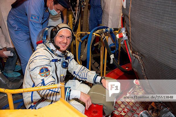 At the Baikonur Cosmodrome in Kazakhstan Expedition 4041 Flight Engineer Alexander Gerst of the European Space Agency poses for a picture May 16 in his Russian Sokol launch and entry suit as he enters the Soyuz TMA-13M spacecraft during a dress rehearsal fit check. Gerst NASA Flight Engineer Reid Wiseman and Soyuz Commander Maxim Suraev of the Russian Federal Space Agency (Roscosmos) are scheduled to launch from Baikonur on May 29 Kazakh time for a 5 ½ month mission on the International Space Station. Victor Zelentsov