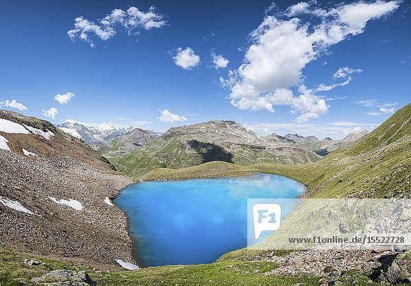 The Lago Vago and peaks of Livigno Province of Sondrio Valtellina Lombardy Italy Europe.