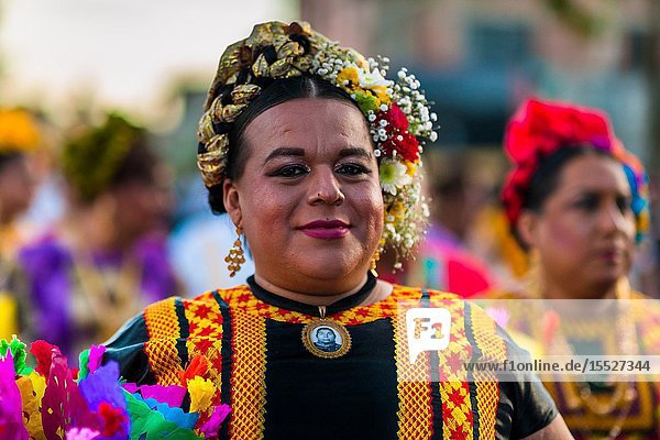 A Mexican â. œmuxeâ.(typically a homosexual man wearing female clothes) takes part in the traditional procession during the Vela de las Intrépidas festival in Juchitán de Zaragoza Oaxaca Mexico 16 November 2018. In the Istmo de Tehuantepec region of southern Mexico the Zapotec indigenous society traditionally divides people into three genders: male female and muxes. The â. œthird genderâ.(muxes) generally represents those who identify as a different gender than assigned at birth. Muxes are shown respect they contribute to society as artists merchants or they stay at the parentsâ.home doing womenâ.s work. Although the three gender system originates in pre-Hispanic indigenous culture the phenomenon of muxes dressing publicly as women started in the 1950s and has been gaining popularity until today.