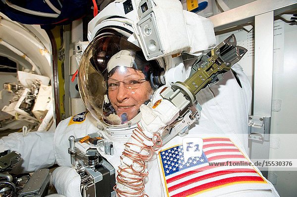 Expedition 50 Flight Engineer Peggy Whitson is suited up in the U.S. Quest airlock getting ready for her record-breaking eighth spacewalk.